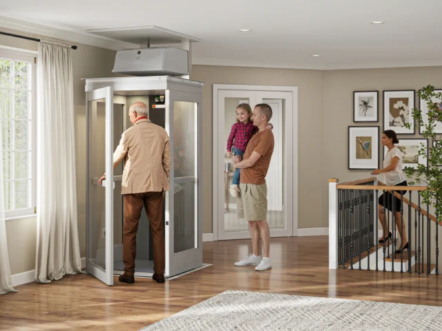 Family with senior walking into a home elevator.