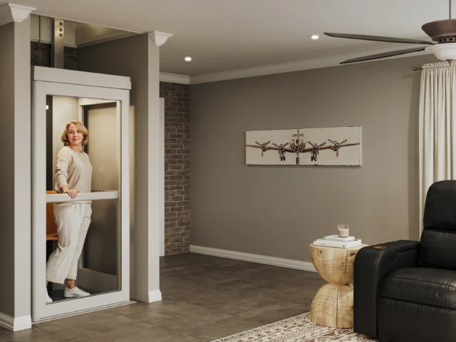 Woman in white rides in her elevator.