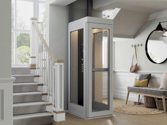 Residential elevator on first floor beside stairs