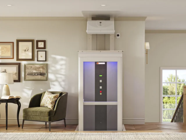 A shaftless, white elevator rises between two floors with a purple glow coming from the cabin ceiling.