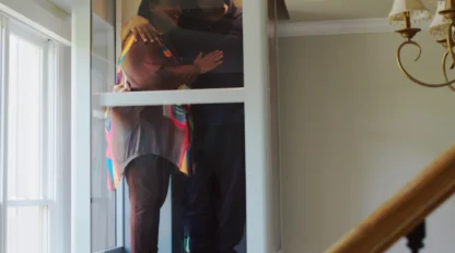 Adult couple embracing happily in their home elevator.