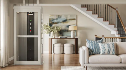 A white home elevator parked in a bright, decorated living room with stairs leading to the second floor in the background.